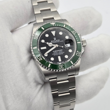 Rolex Submariner Date 41 mm (Ref. 126610LV) - 2026 - Green Bezel “Starbucks” in white gloved hand