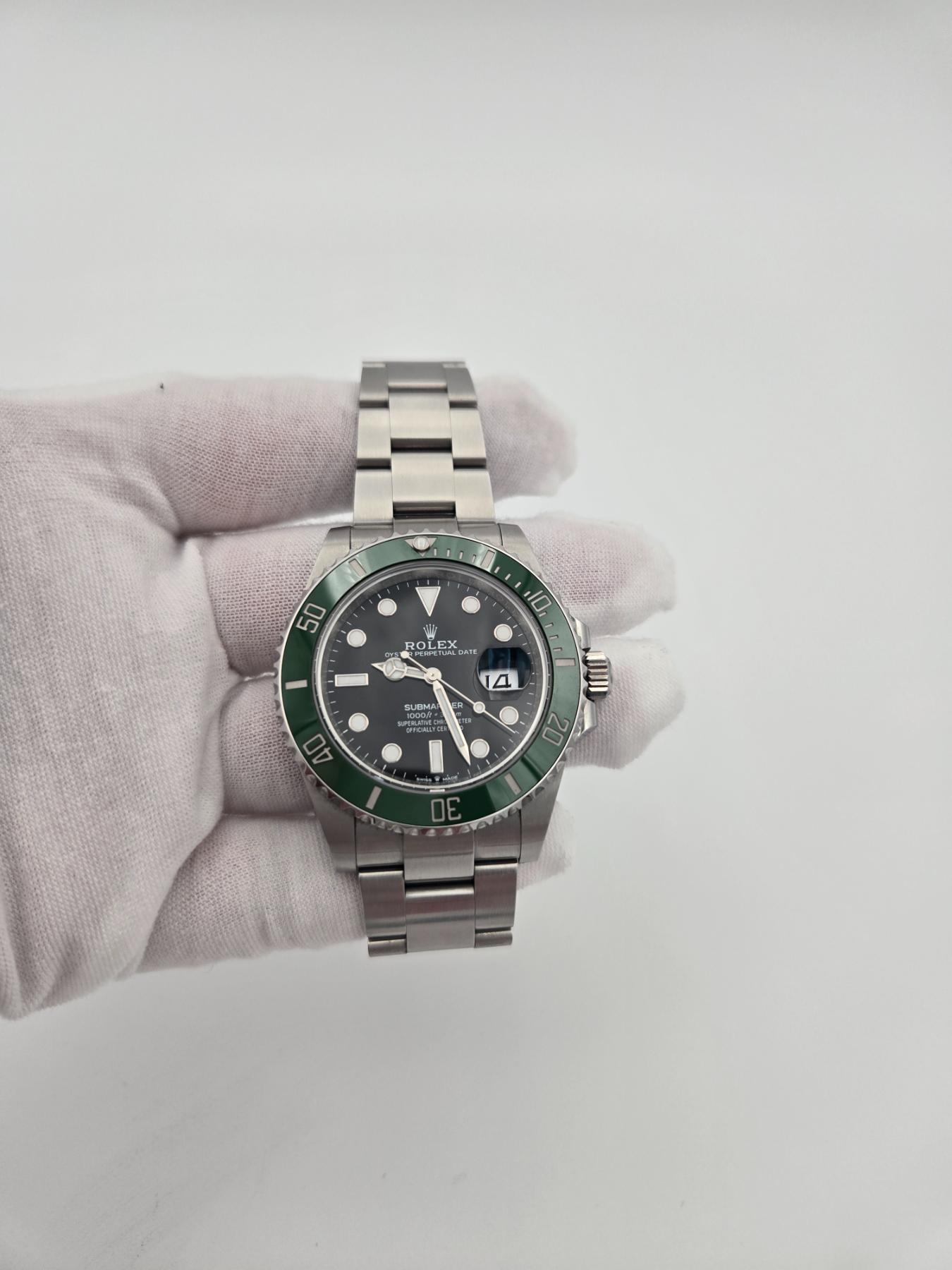 Pre-Owned Luxury watch in hand with white background