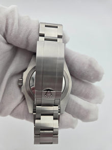 Back of steel watch 126610lv in gloved hand