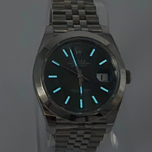 Luminous hand details on Rolex Datejust 41 (126300) - Green Dial & Jubilee Bracelet