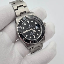 Rolex Submariner Date 126610LN Black Dial 41mm in gloved hand