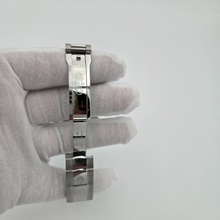 Open clasp of silver Rolex with white background