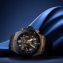 Hublot Big Bang Unico King Gold 42mm with intricate design on a blue fabric background