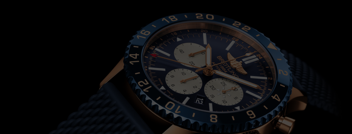Wristwatch with a blue strap and black dial on a dark background