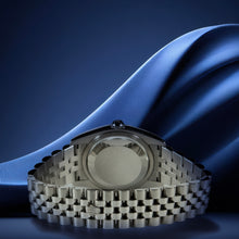 Back of Rolex Datejust 36 watch on a blue fabric background
