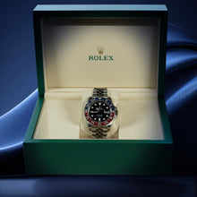 Rolex GMT Master II Pepsi watch in a green box with a blue gradient background