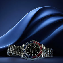 Luxury watch with a blue strap on a dark blue fabric background