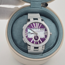 Ulysse Nardin Executive Dual Time Lady with purple dial and white band in circular watch box.