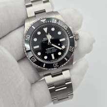 Rolex Submariner 124060 in gloved hand