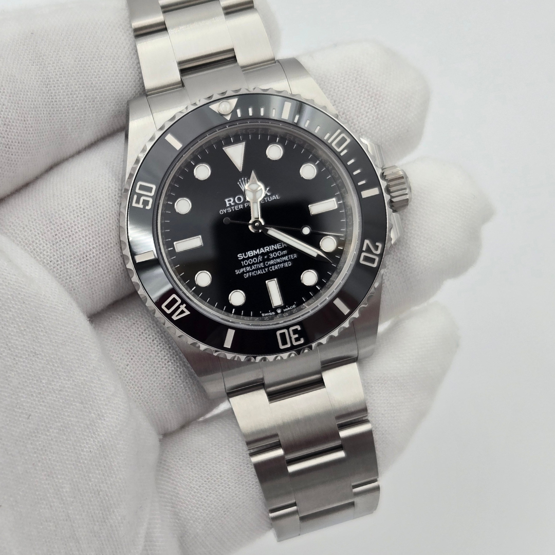 Rolex Submariner 124060 in gloved hand