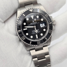 Rolex Submariner Date 126610LN 41mm in white gloved hand