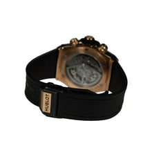 Hublot watch with black strap and bronze case on a white background